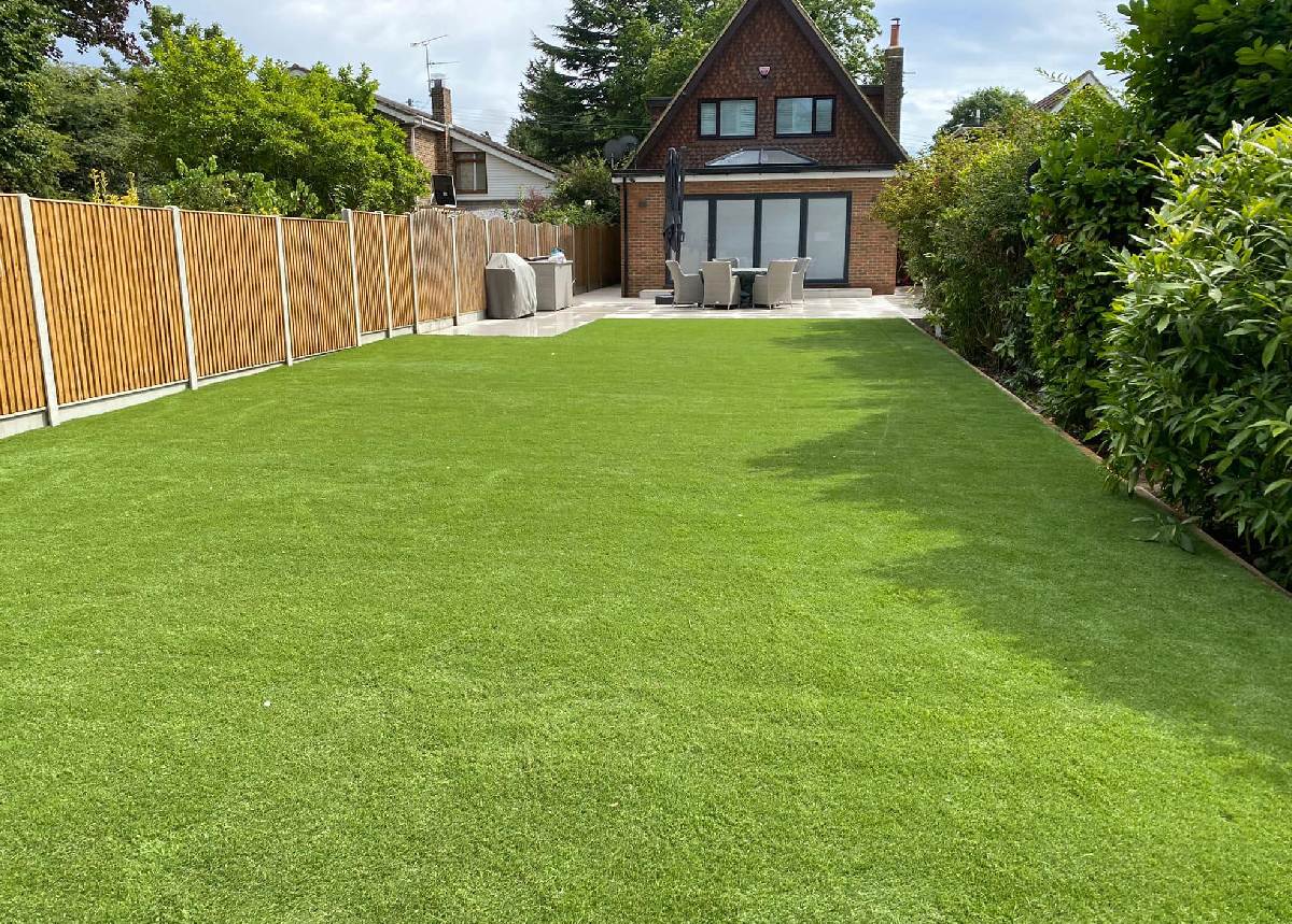 Artificial grass laid in a long wide garden